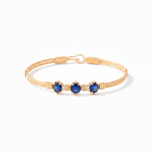 You Are My Sunshine Bracelet with round blue sapphire stones in 14k gold artist wire